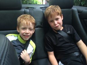 Bodhi and Griffin pose in the back of the Beamer. "We like this car, Daddy. We should buy ti."